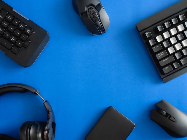 Gaming desk with keyboard, mouse and headphones