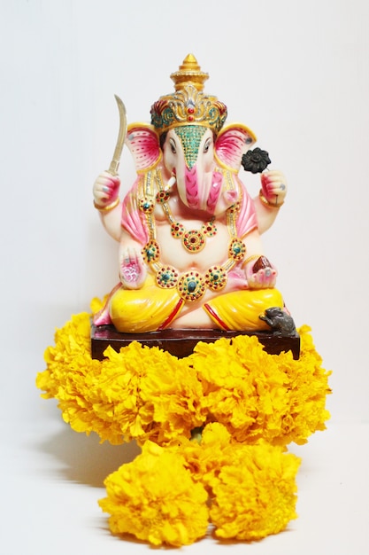 Ganesha god is the Lord of Success God of Hinduism on Marigold flowers 