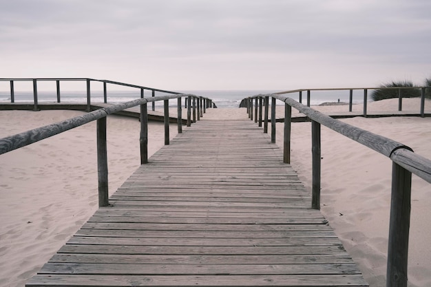 Photo gangway amidst sand on a beach