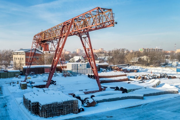 Gantry crane in open warehouse Sunny winter day