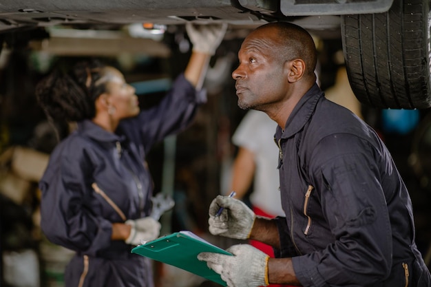 Garage mechanic team working car auto service black african people professional worker together