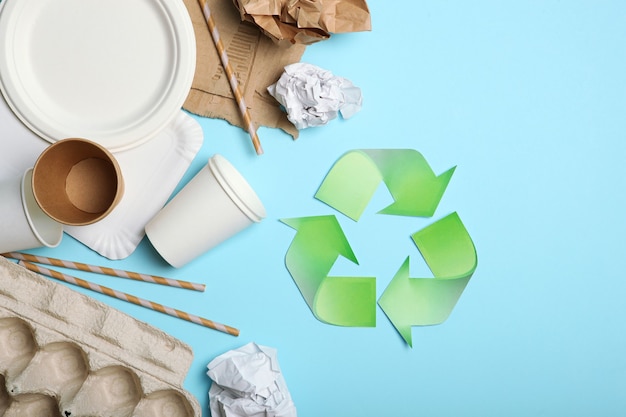 Garbage and recycling sign on a colored background top view