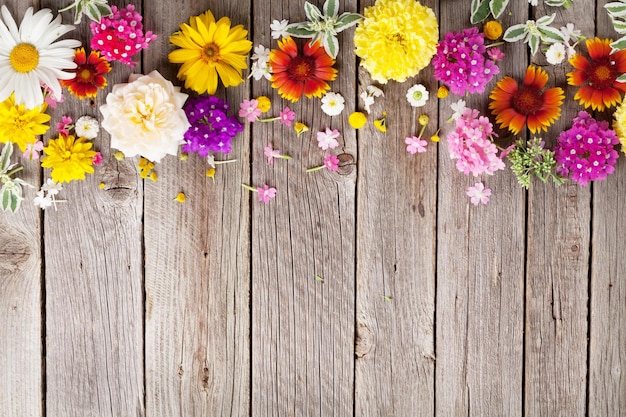 Garden flowers over wooden background