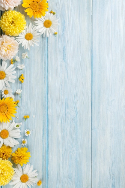 Garden flowers over wooden background