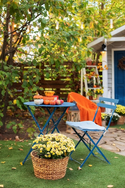 Garden table and chairs on autumn yard