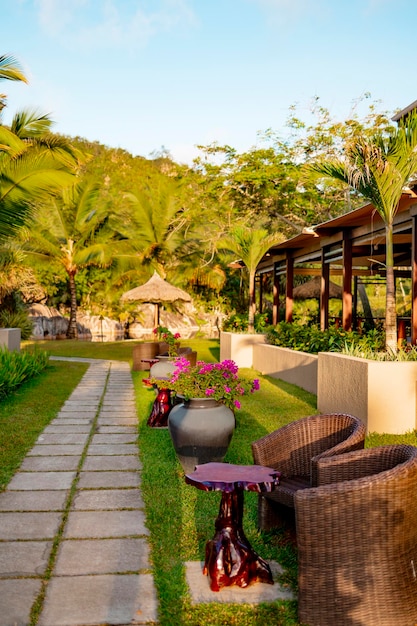 a garden with a table and chairs and a sign that says  no