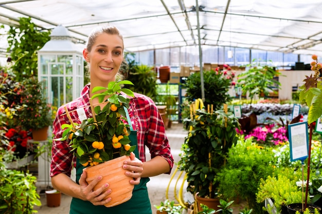 gardener in her green house flower shop