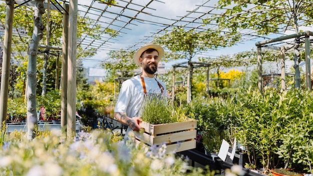 Gardener holding a box of plants Ecommerce online order concept