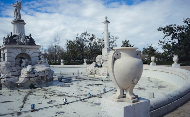 Gardens of the city of Aranjuez, located in Spain. Stone palace and beautiful autumn landscapes with beautiful fountains and mythological figures