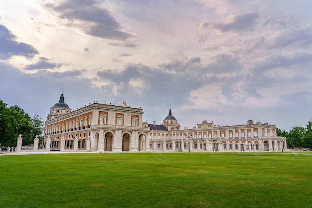 Gardens and royal palace of Aranjuez in cloudy day at sunset