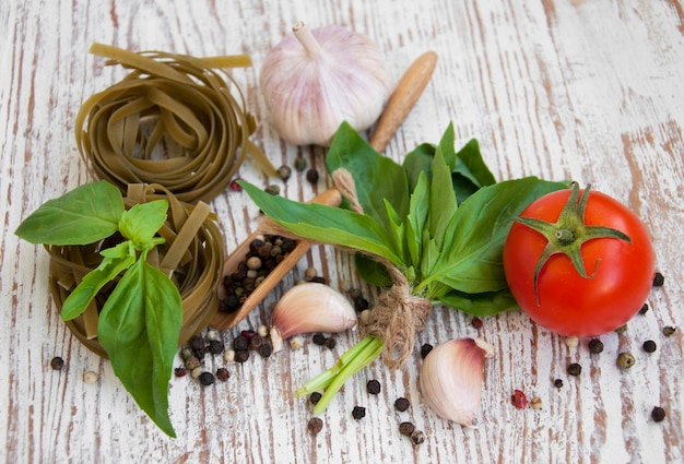 Garlic basil peppers on a wooden background