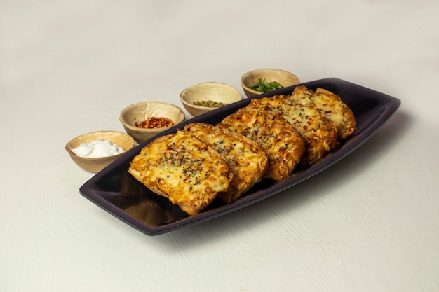 garlic bread with spices on a white background, Toasts with cheese and spices,