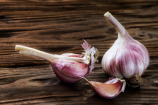 Garlic closeup on a brown wooden kitchen table