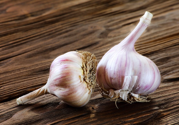 Garlic closeup on a brown wooden kitchen table