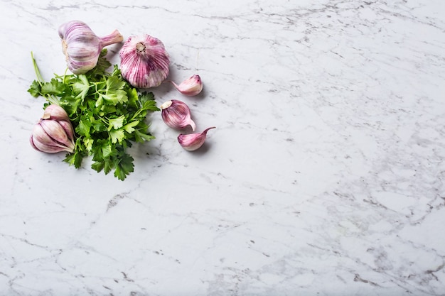 Garlic Cloves and Bulbs with parsley herbs salt and pepper.