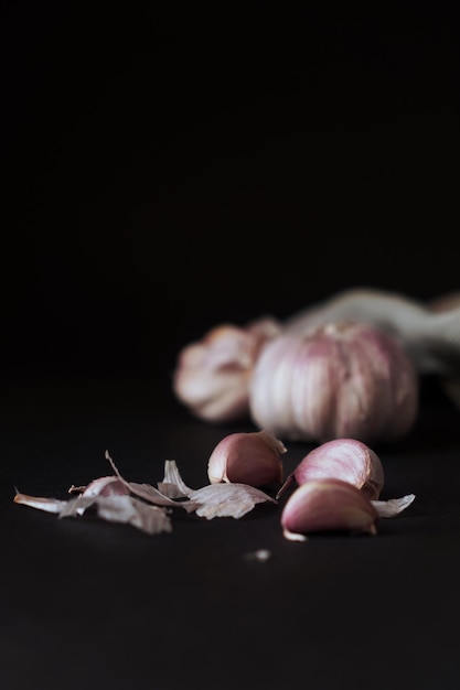 Garlic cloves on a dark background