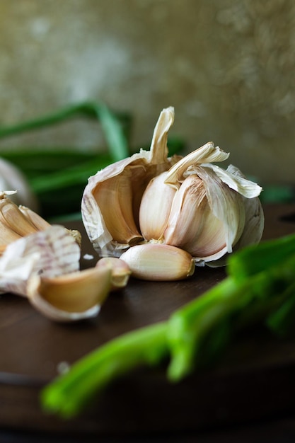 Garlic cloves and green onion Rustic style food photography