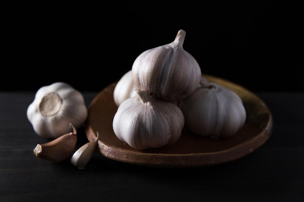 Garlic cloves on wooden vintage background