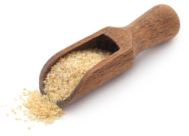 Garlic dried and grated over white background