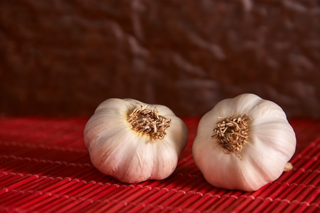 Garlic on a red style background