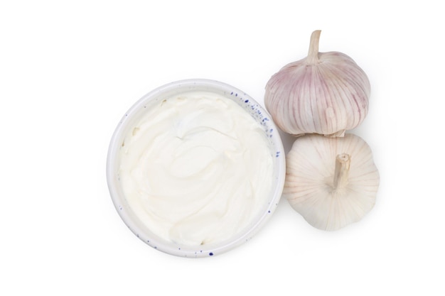 Garlic sauce and ingredients isolated on white background