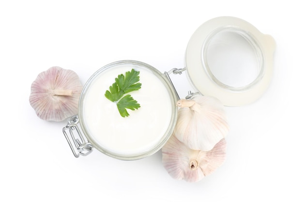 Garlic sauce and ingredients isolated on white background