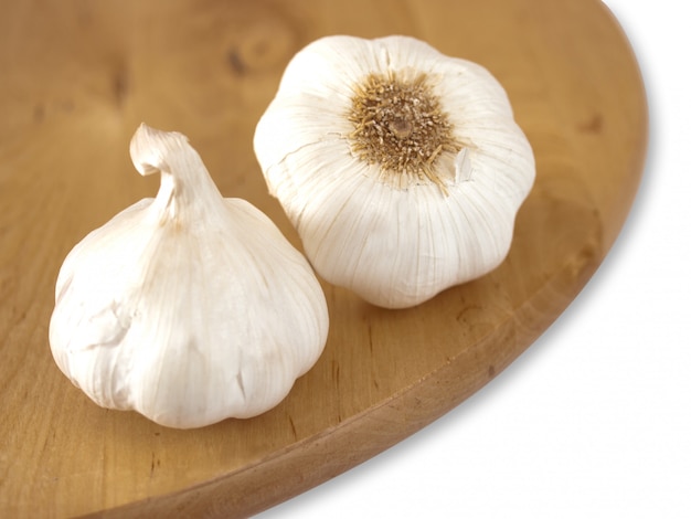 garlic on wooden cutting board