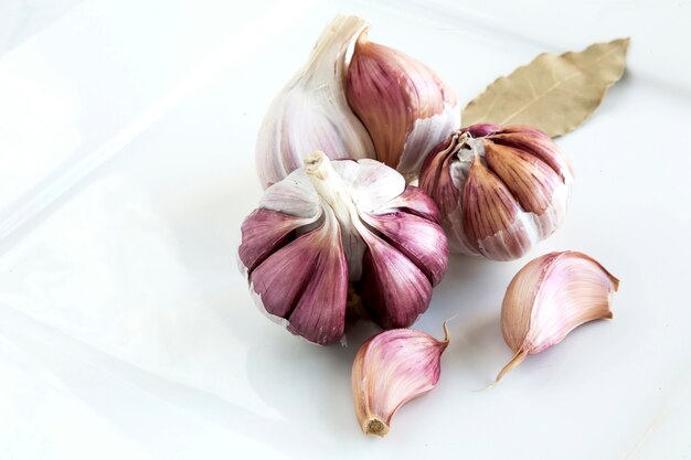 Garlics on wooden board