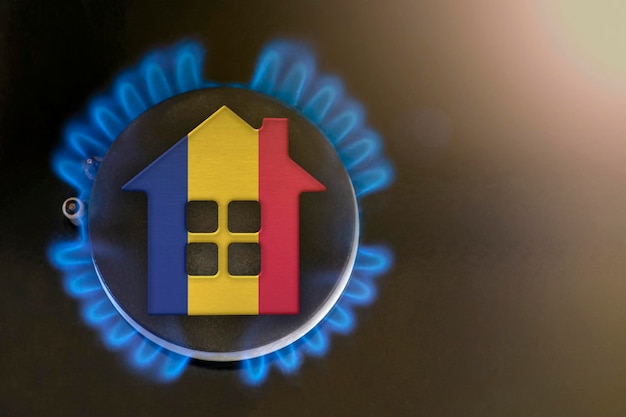 Gas crisis Rising utility costs in Romania Energy crisis exportimport problems in Romania The concept gas burner and house model are colored in the colors of the flag