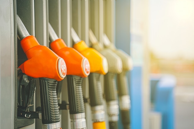 Gas station. Gas pump nozzles on the petrol station.