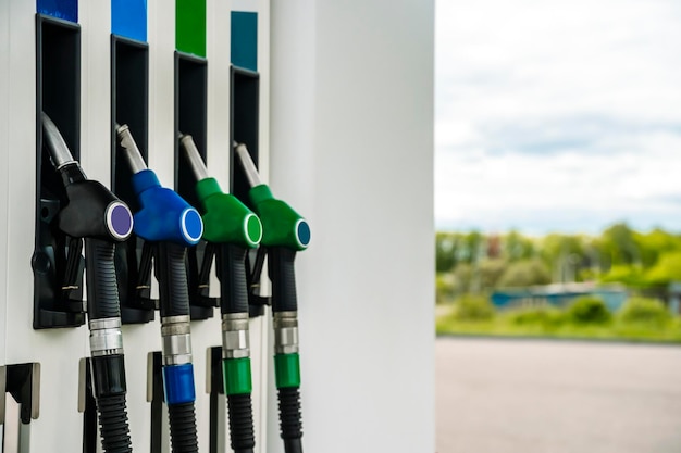 Gas station Pistols with gasoline and diesel fuel at a car gas station Oil business and transportation costs