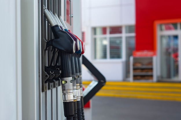 Gas station with diesel and gasoline close-up on the background of a shop window.