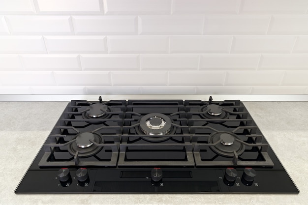 Gas stove in the kitchen is installed in the countertop.