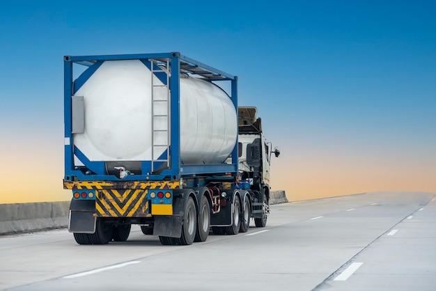 Gas Truck on highway road with tank oil  container, transportation concept.,import,export logistic industrial Transporting Land transport on the expressway with blue sky.image motion blur