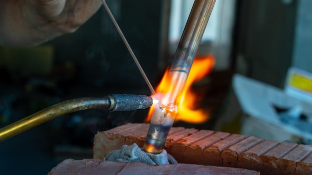 gas welding of copper pipes closeup