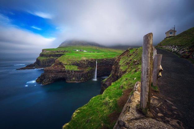 Gasadalur village and Mulafossur waterfall on Faroe Islands Denmark