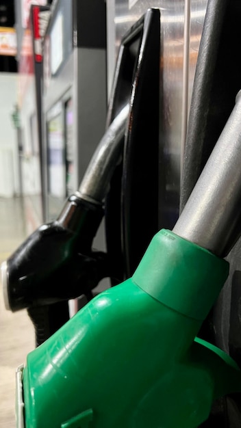 Gasoline rise concept Male hand filling the gas tank of the car Closeup of man hand supplying gasoline to vehicle