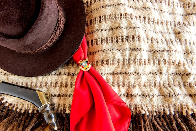 Gaucho tradition hat red scarf and poncho