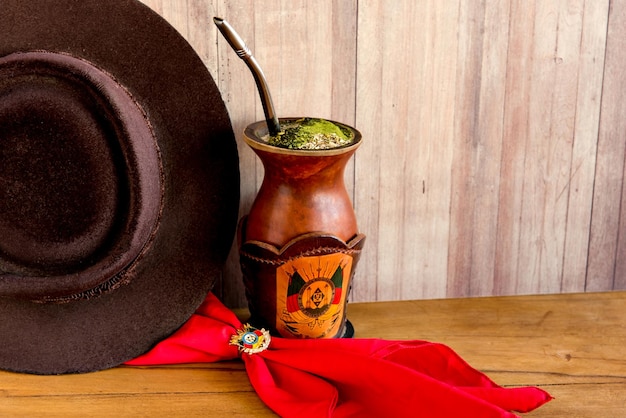 Gaucho tradition hat red scarf and yerba mate tea