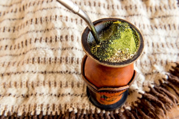 Gaucho tradition poncho and chimarrao of yerba mate tea