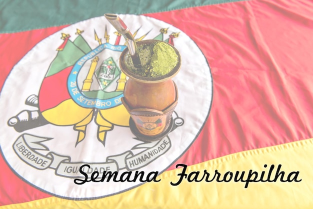 Gaucho yerba mate chimarrao tea with a background of the flag of the State of Rio Grande do Sul