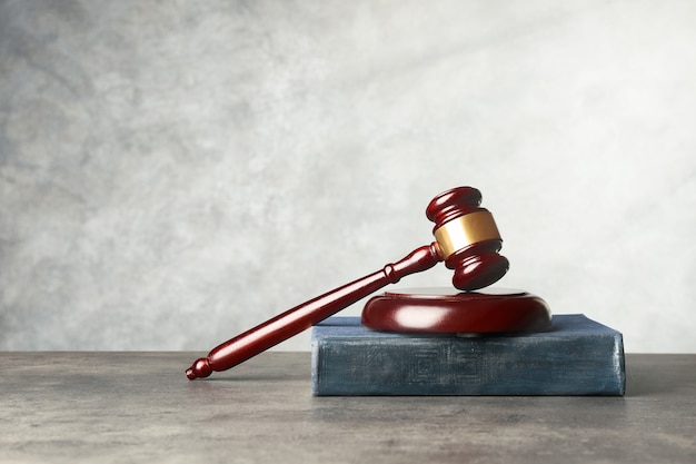 Gavel and book on table