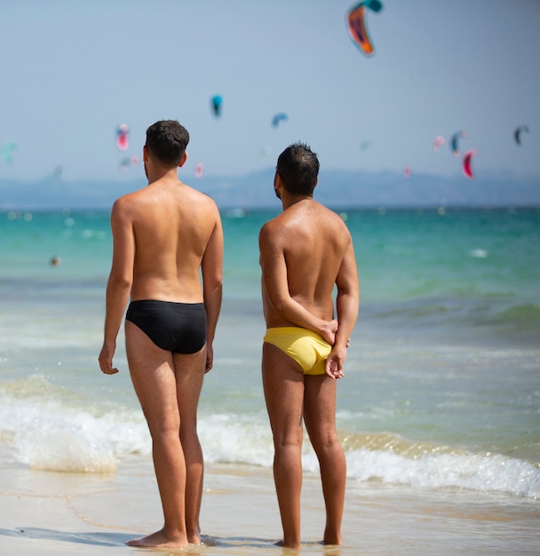 gay couple enjoying time on the beach