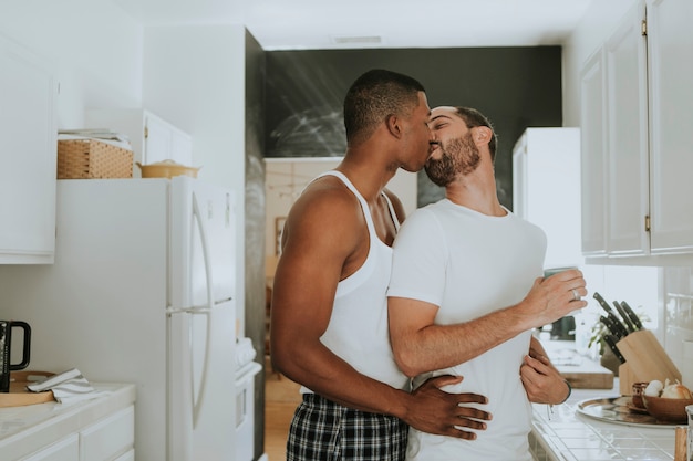 Gay couple hugging in the kitchen