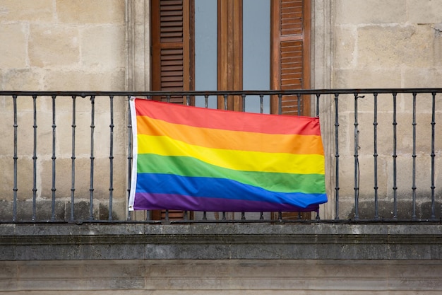 Gay LGTBi pride flag hanging on a balcony