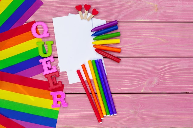 Gay pride flag on wooden table