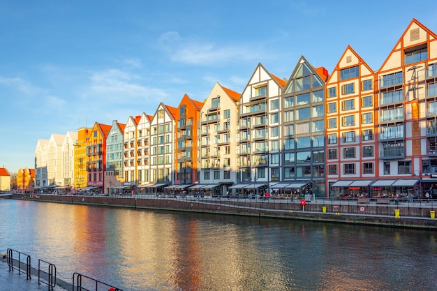 Gdansk Poland 11 March 2022 view of the city and the river Motlawa with a buildings on the embankment