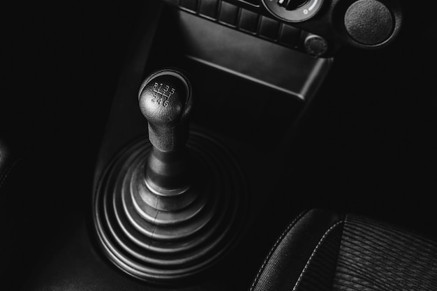 Gear stick of manual transmission of car with 6-speed and reverse position, automotive part concept.