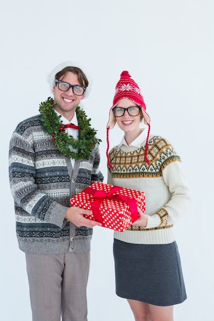 Geeky hipster couple holding present 