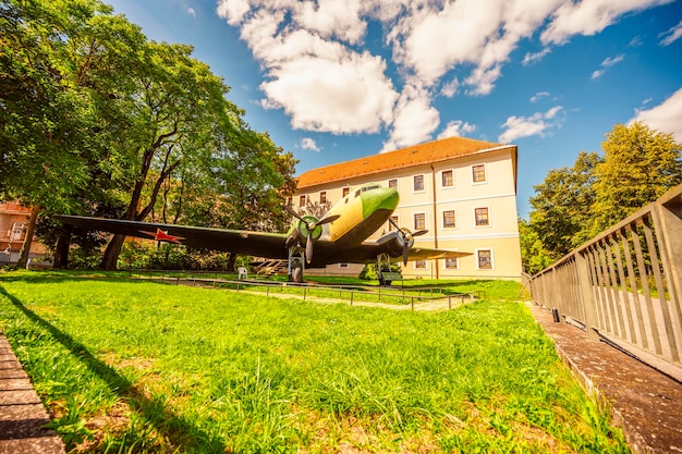 General view of the Museum of Slovak National Uprising built 1969 Banska Bystrica Slovakia Several green coloured artillery cannons tanks and plane from WW2